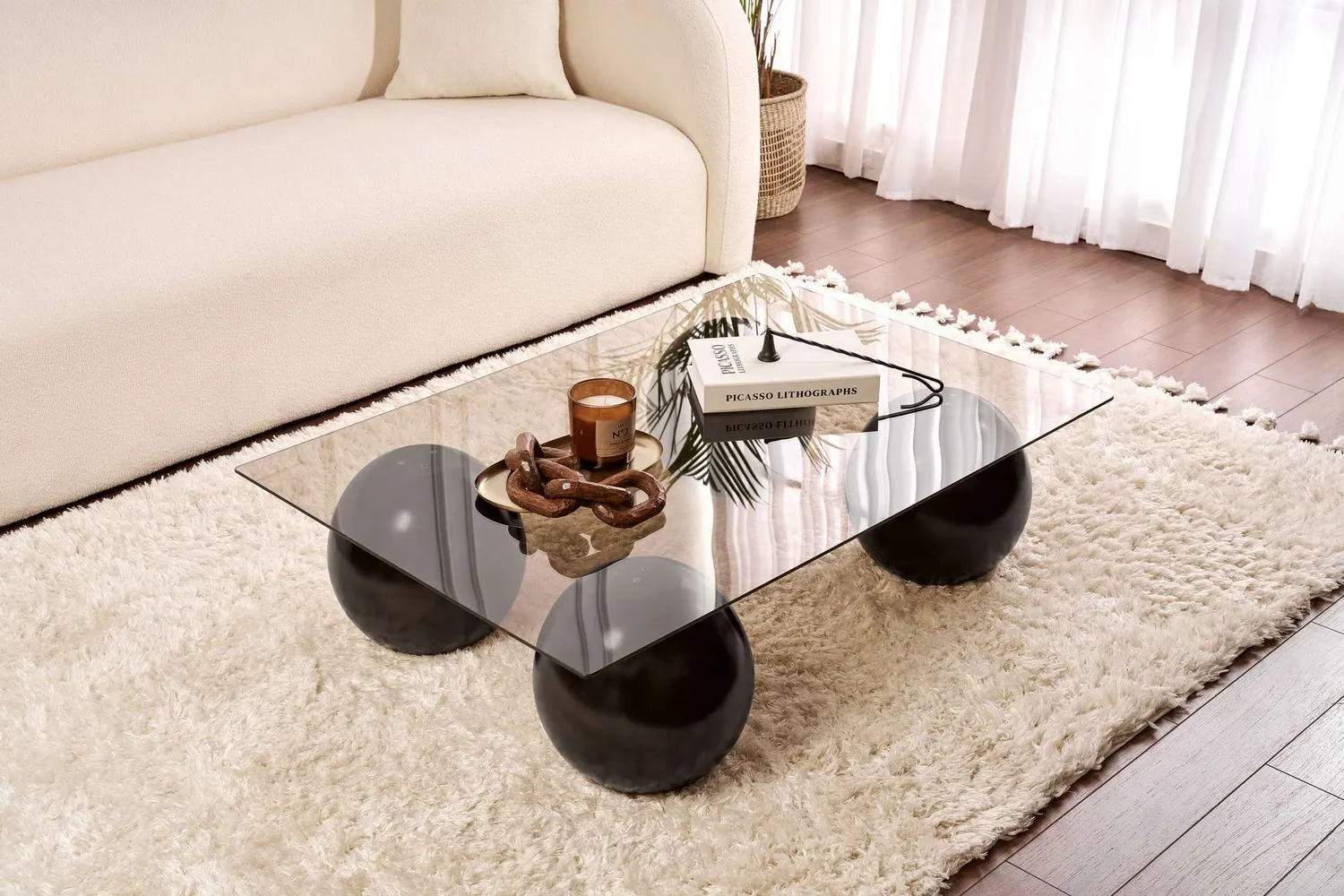 Stolik kawowy SERA 75x110 cm nogi czarne kule blat szklany brązowy - ASI_857NRD1121