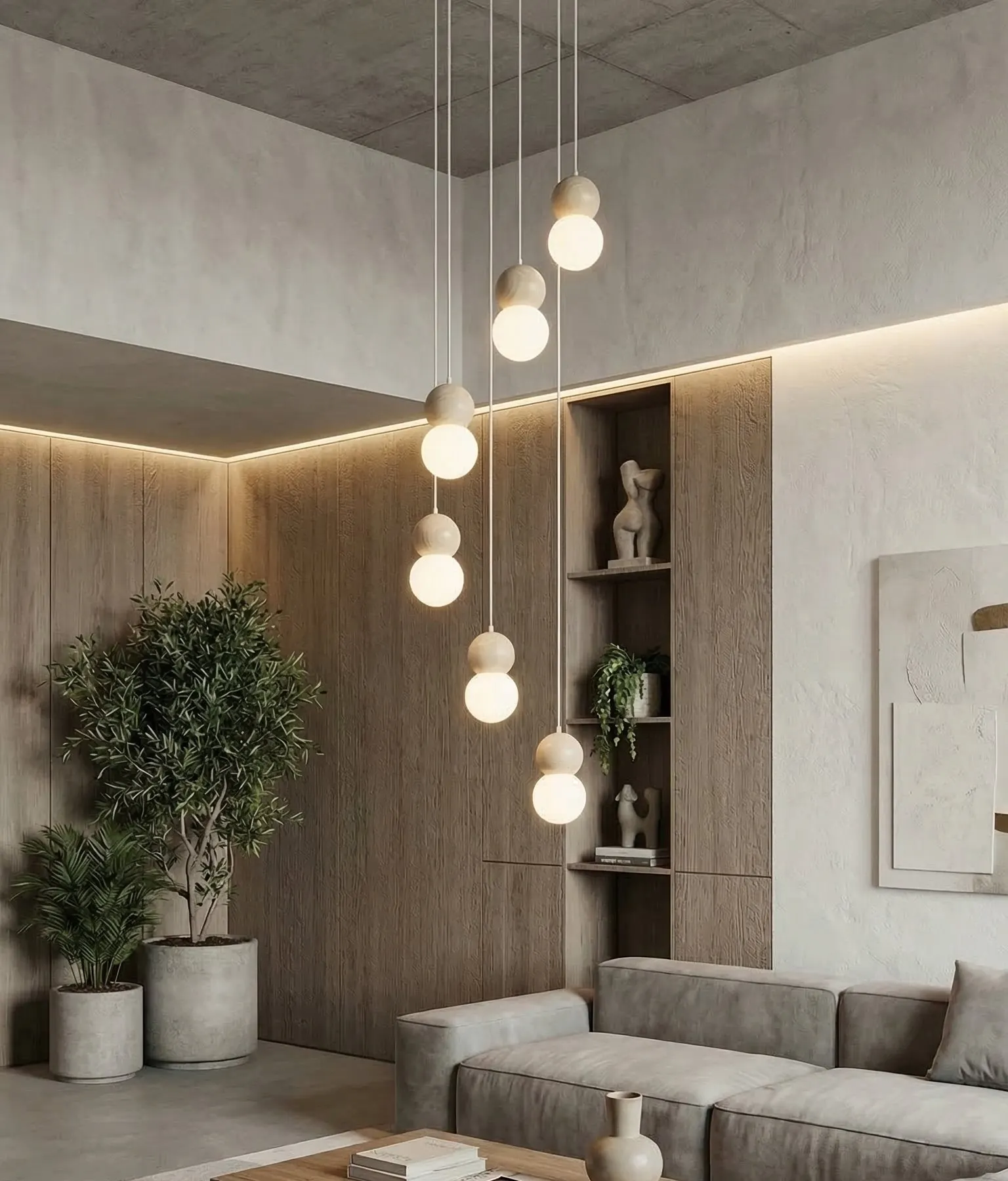 lampa wisząca, kule światła, wnętrze nowoczesne, sofa welurowa, duże doniczki