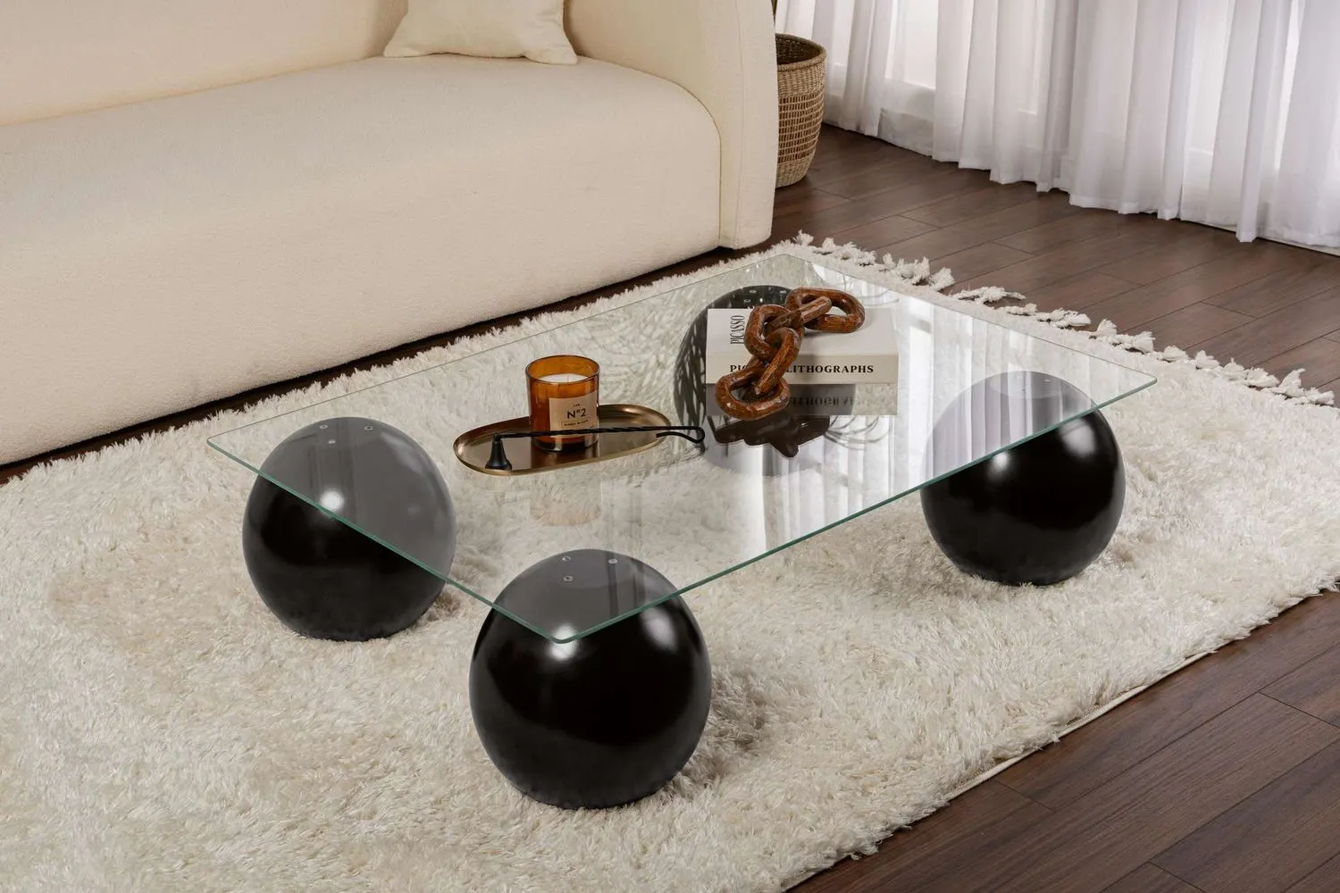 Stolik kawowy SERA 75x110 cm nogi czarne kule blat szklany transparentny — zdjęcie 2