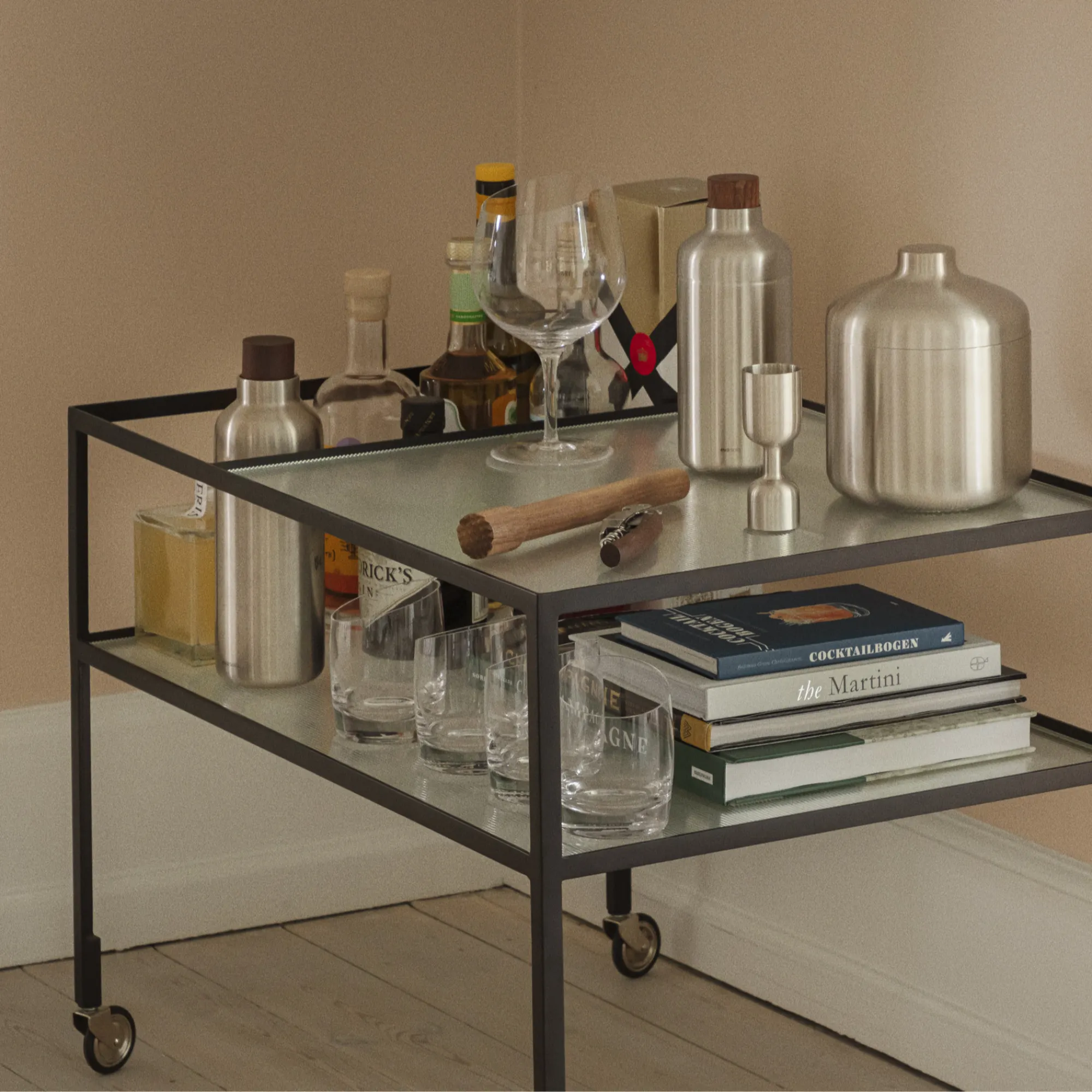 image bar cart, bartender cart, drinkware, cocktail shaker, books on cart